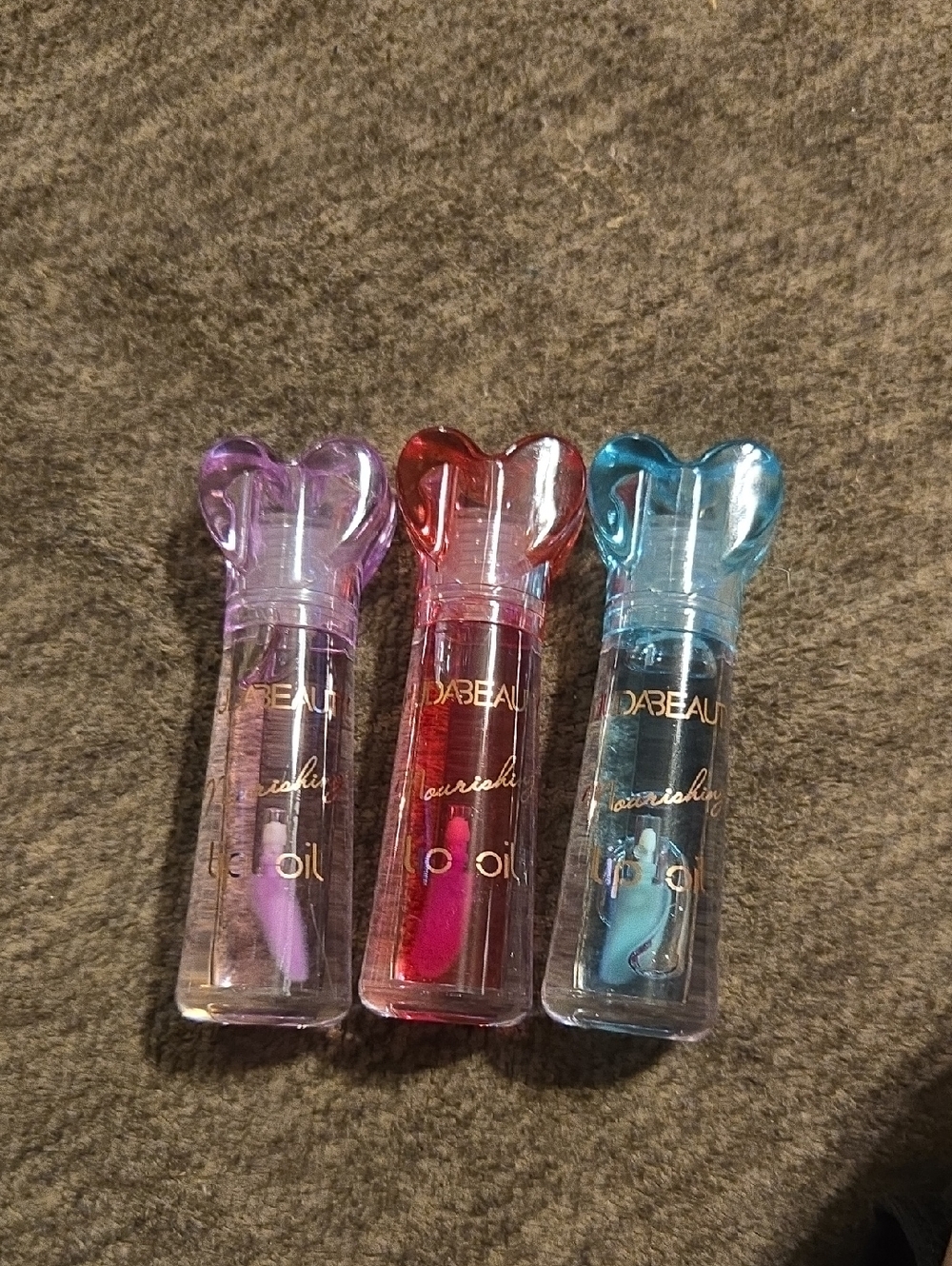 Huda beauty Lip Oil Trio — Pink, Red, Blue